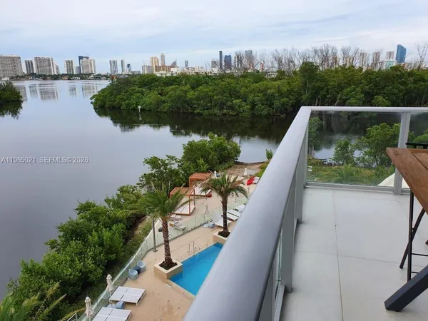 a view of balcony with outdoor space and lake view