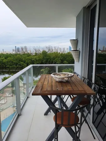 a view of deck with furniture and wooden floor