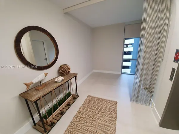 a view of a hallway with windows