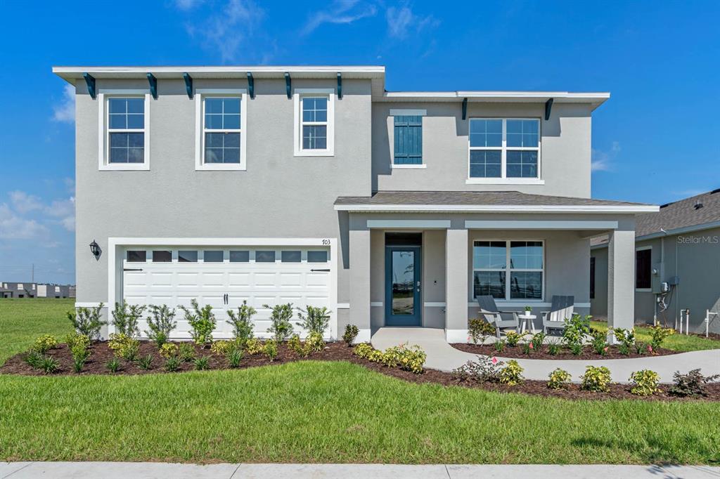 3766 Bluethread Way Kissimmee, FL 34759 - Photo 1 of 1 a front view of a house with a yard and garage