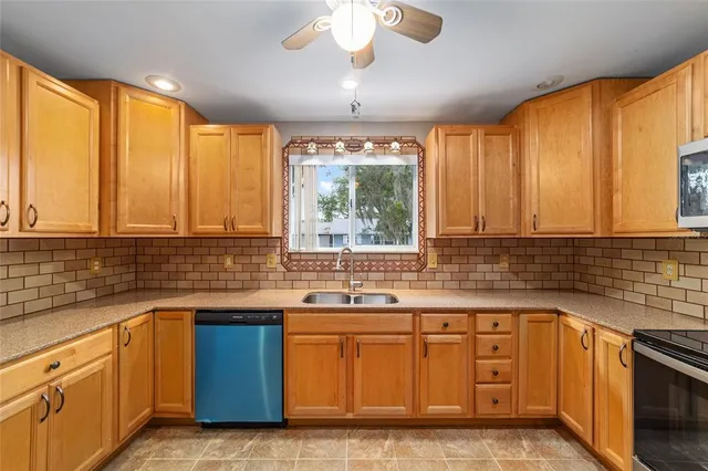 a kitchen that has a sink and a stove