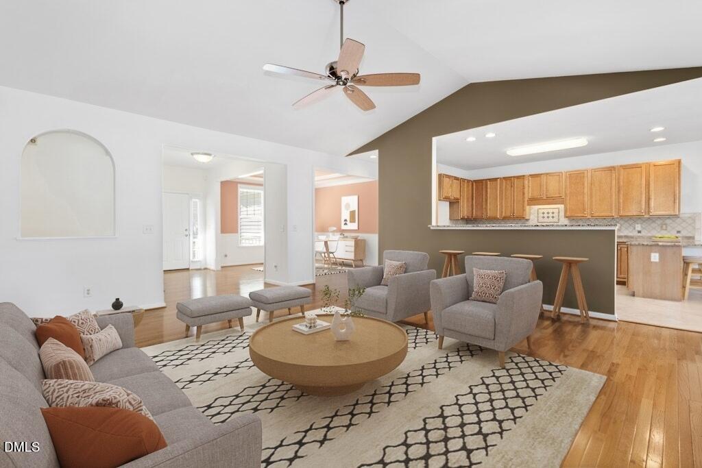 4800 Rhythm Drive Apex, NC 27539 - Photo 10 of 32 a living room with furniture and a wooden floor