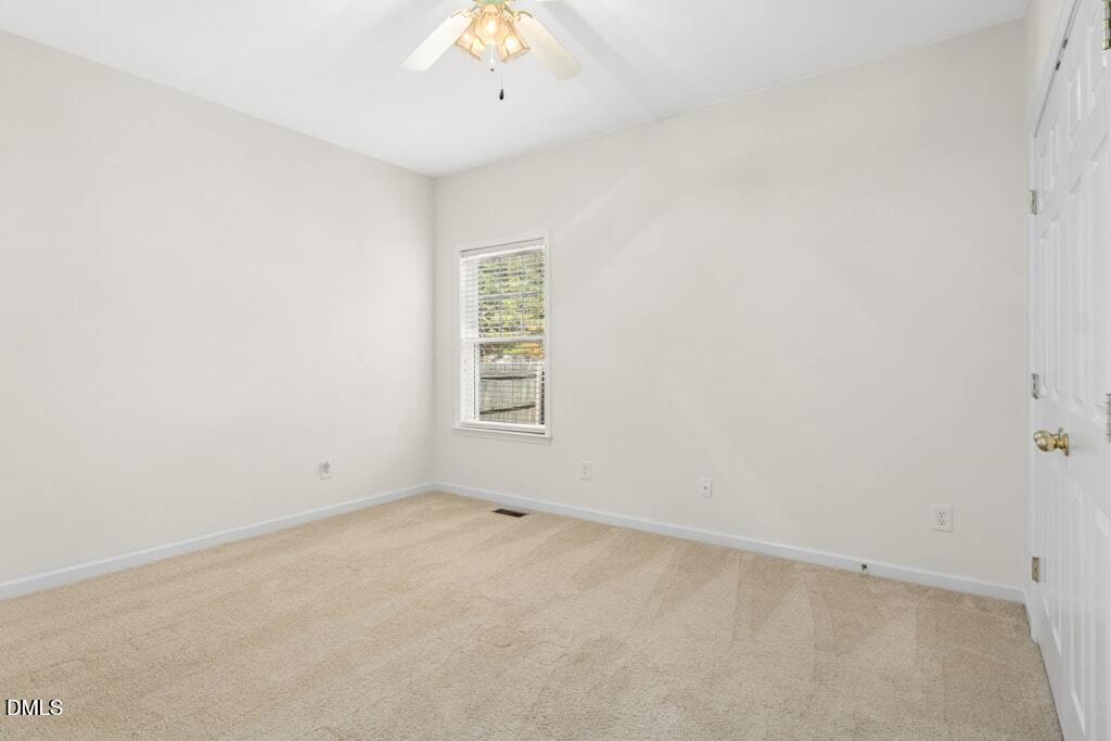 4800 Rhythm Drive Apex, NC 27539 - Photo 24 of 32 an empty room with a window