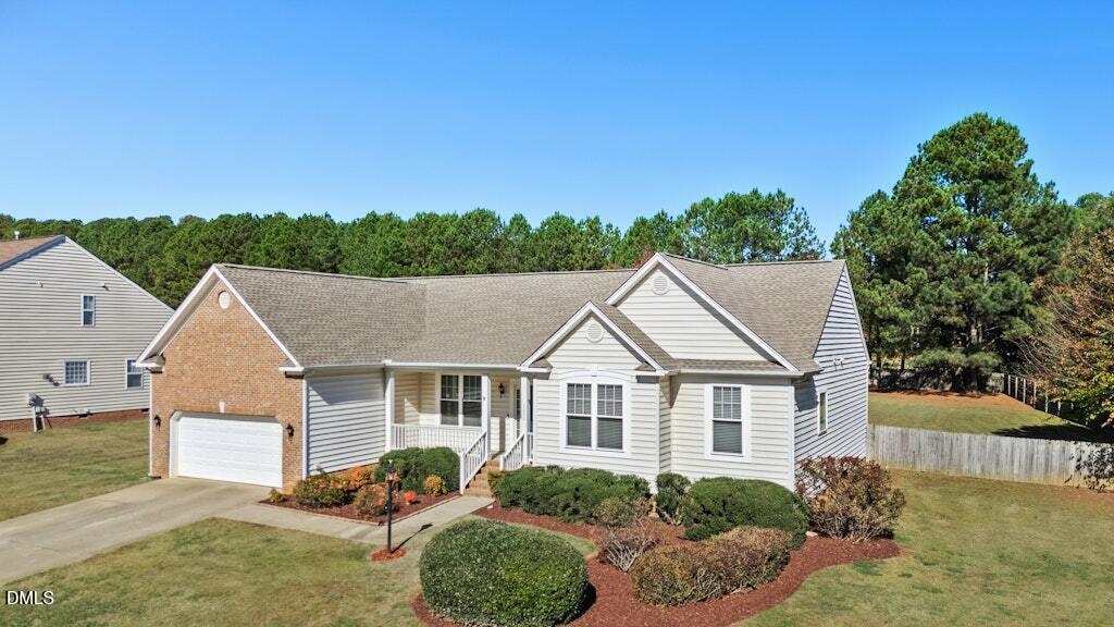 4800 Rhythm Drive Apex, NC 27539 - Photo 2 of 32 a view of a house with backyard and garden