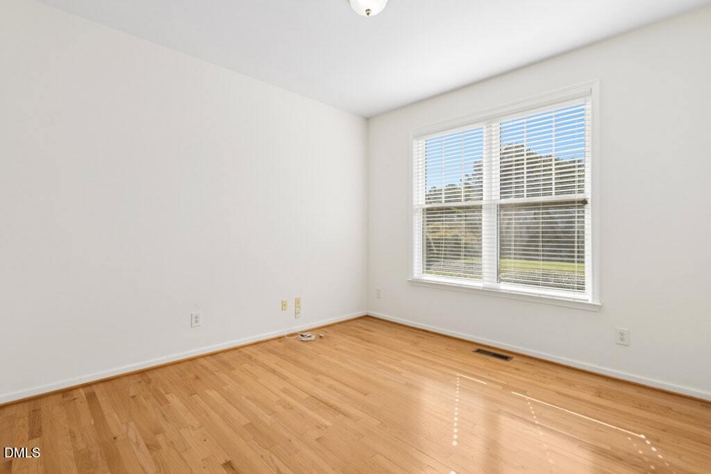 4800 Rhythm Drive Apex, NC 27539 - Photo 7 of 32 a view of an empty room with a window