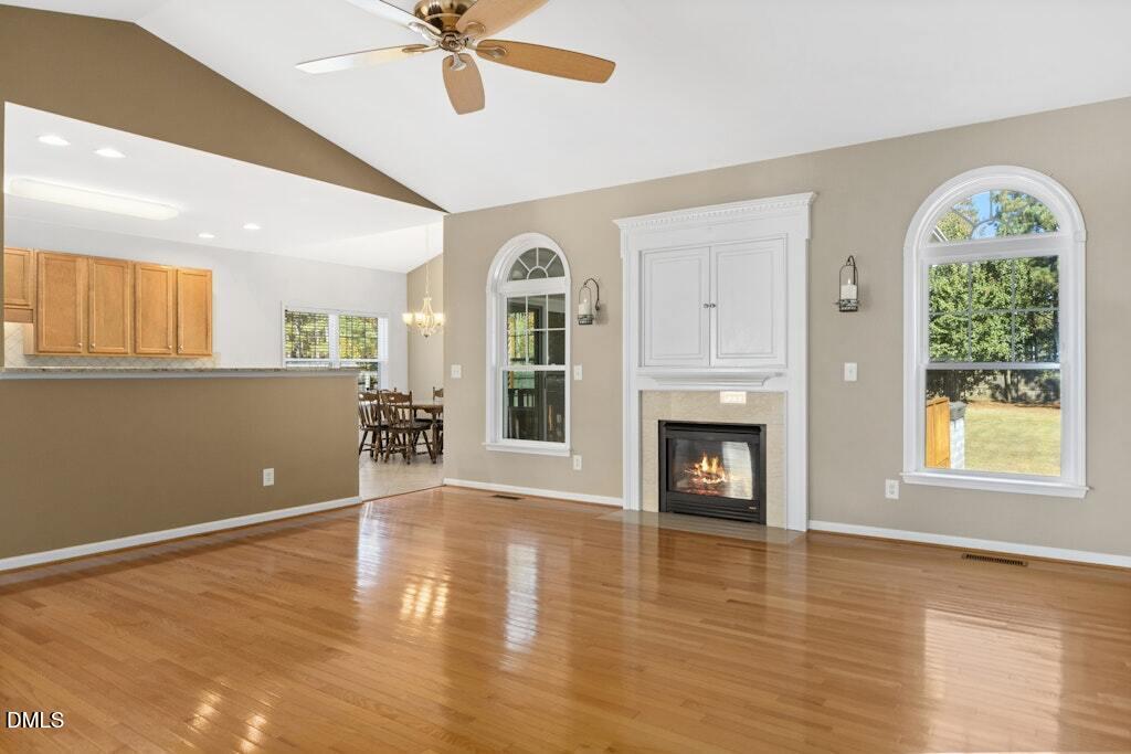 4800 Rhythm Drive Apex, NC 27539 - Photo 9 of 32 a view of an empty room with a window and fireplace