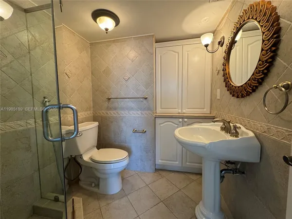 a bathroom with a shower and a toilet