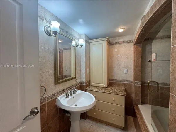 a lobby with furniture and floor to ceiling window