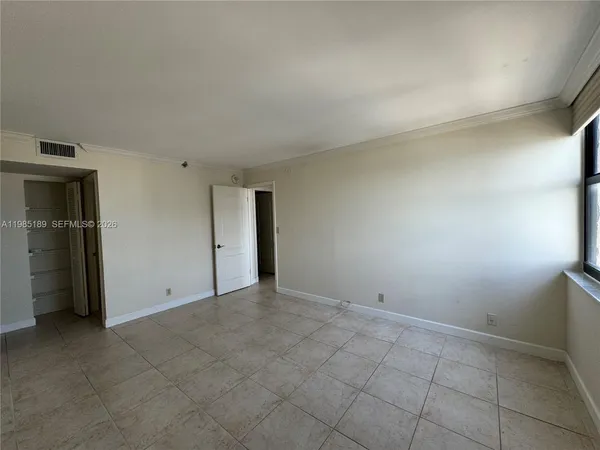 a view of a chair and table on the wooden floor