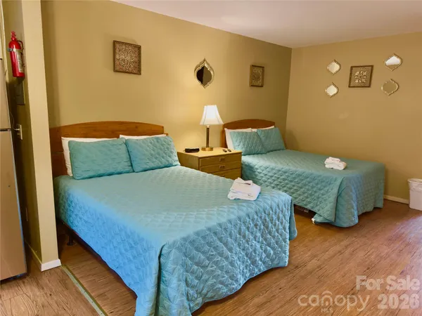 a bedroom with bed and a window