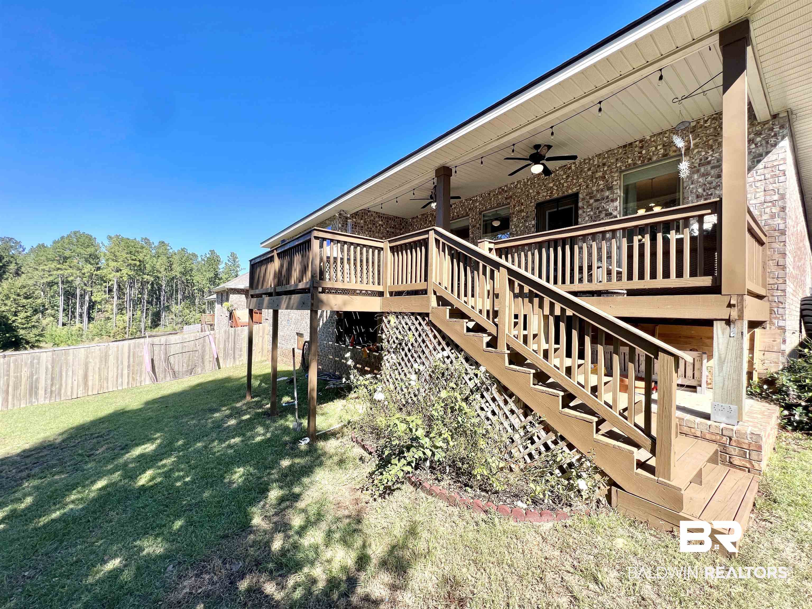 32290 Calder Court Daphne, AL 36527 - Photo 56 of 59 View of yard featuring a deck and ceiling fan