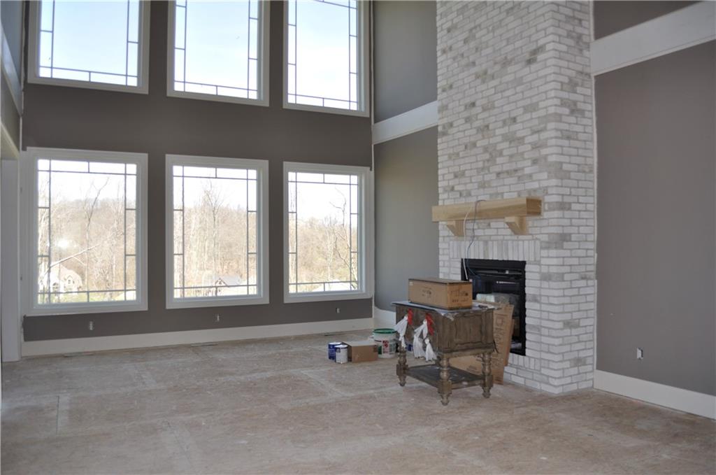 104 Eagle Rdg Road Cranberry Township, PA 16066 - Photo 4 of 18 a view of a livingroom with chair and tables