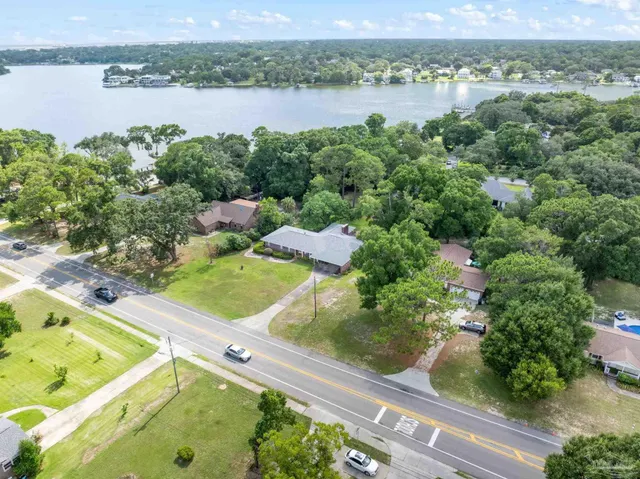 an aerial view of a house with a lake view
