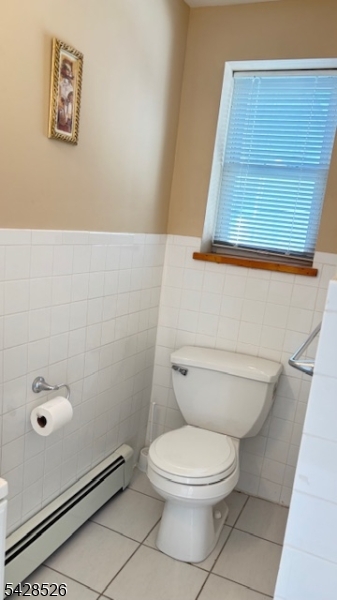 321 John Street Harrison, NJ 07029 - Photo 11 of 13 a bathroom with a toilet and a shower