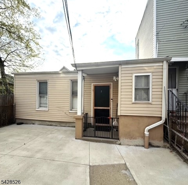 321 John Street Harrison, NJ 07029 - Photo 13 of 13 a view of house with a outdoor space