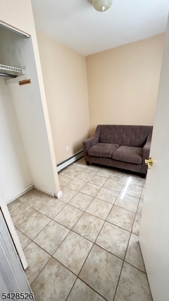 321 John Street Harrison, NJ 07029 - Photo 4 of 13 a living room with a couch
