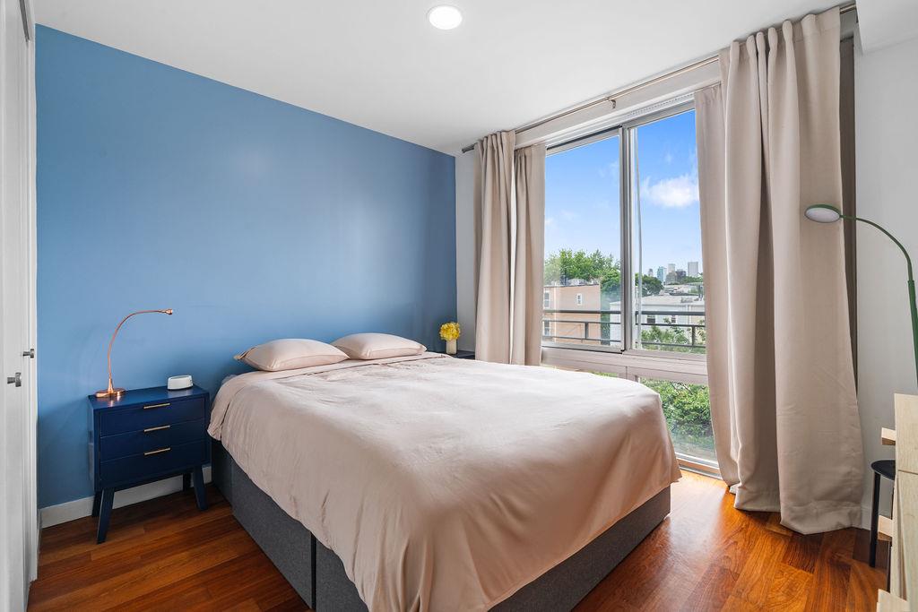 185 13th Street, Unit 3B Brooklyn, NY 11215 - Photo 6 of 8 a bedroom with a bed and a large window