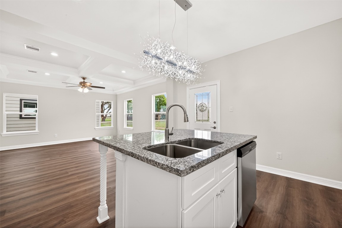 418 North 4th Street Beasley, TX 77417 - Photo 13 of 27 a kitchen with a sink and chandelier