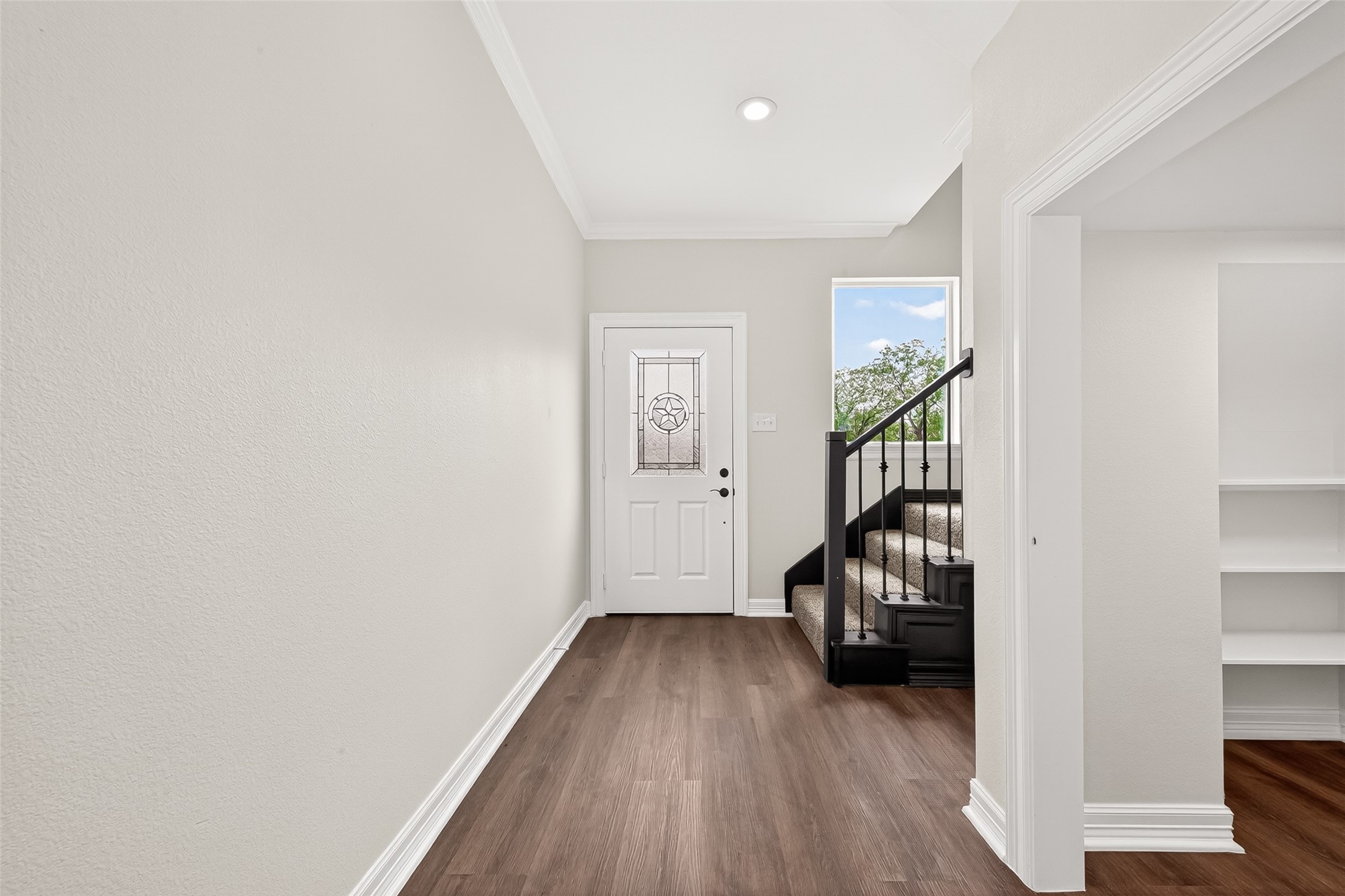 418 North 4th Street Beasley, TX 77417 - Photo 3 of 27 a view of a livingroom with wooden floor staircase and a hallway