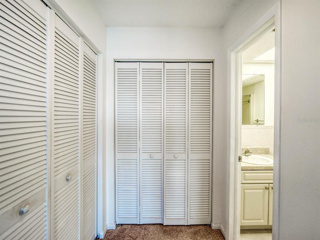 4939 Floramar Terrace, Unit 912 New Port Richey, FL 34652 - Photo 27 of 55 a view of wooden floor and windows in a room