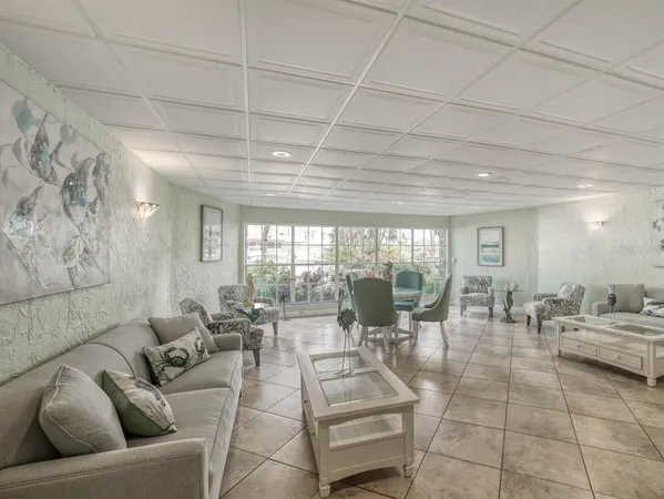 a view of a swimming pool with outdoor seating