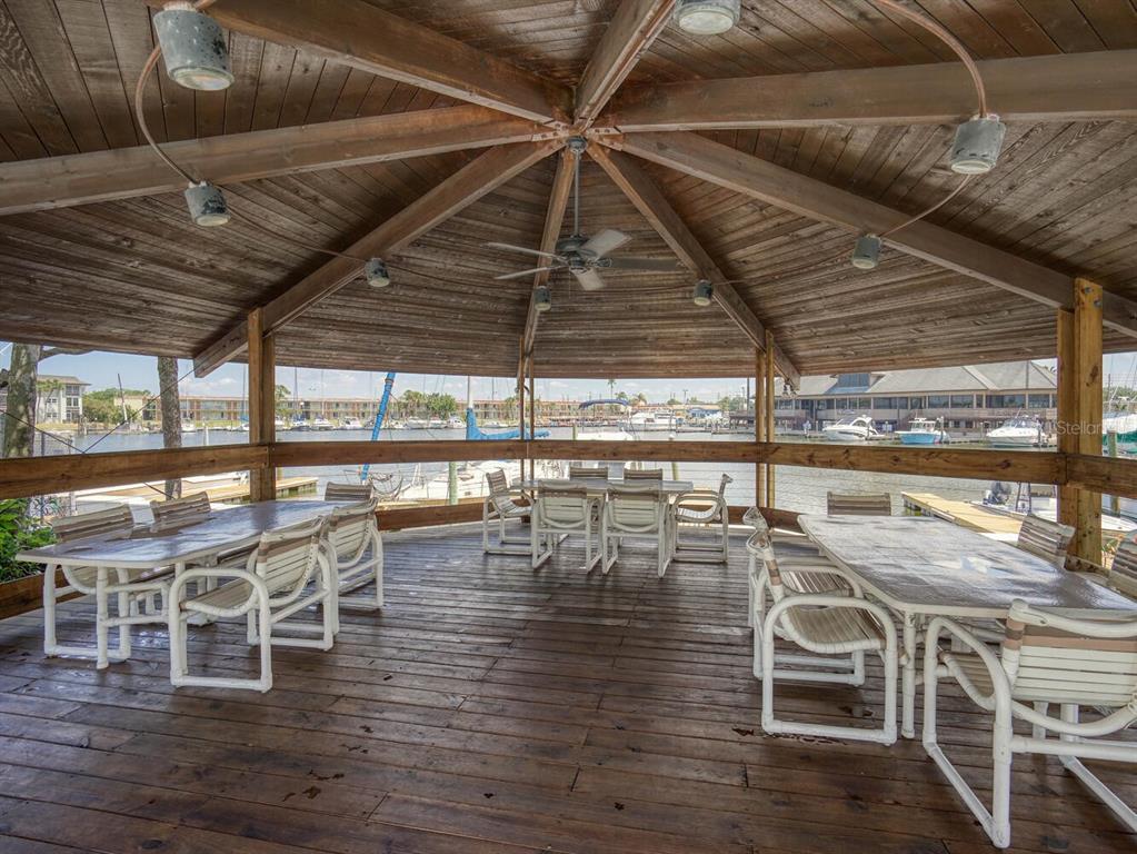 4939 Floramar Terrace, Unit 912 New Port Richey, FL 34652 - Photo 38 of 55 a view of a swimming pool with outdoor seating