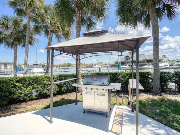 a view of swimming pool with outdoor seating and lake view