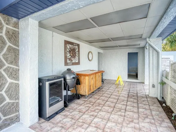 a swimming pool with outdoor seating and yard