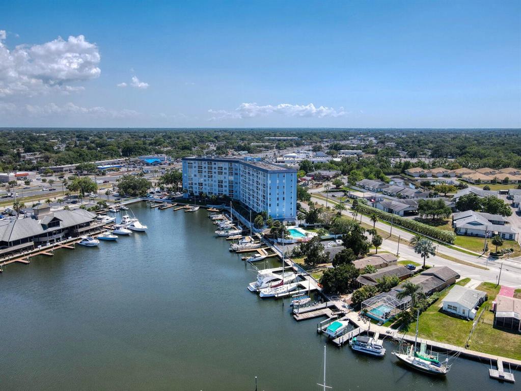 4939 Floramar Terrace, Unit 912 New Port Richey, FL 34652 - Photo 50 of 55 an aerial view of a houses with a yard