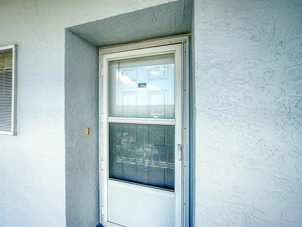 a view of a glass door of a house