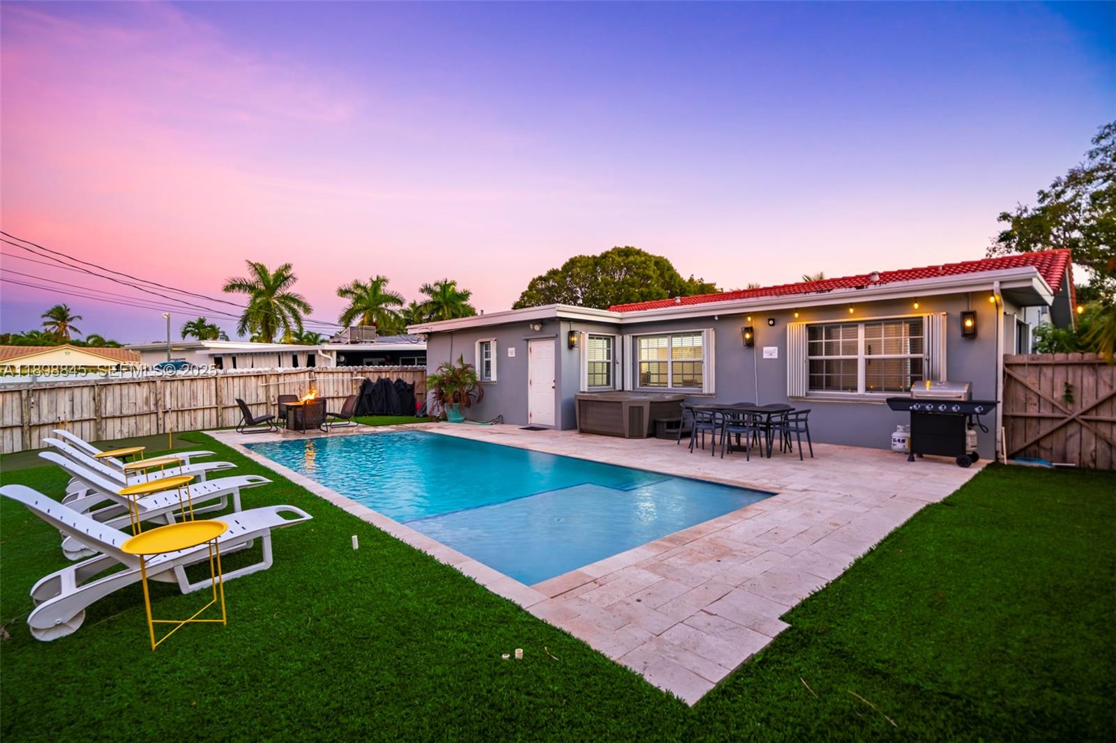 1305 Funston Street Hollywood, FL 33019 - Photo 11 of 93 a view of a house with pool and chairs
