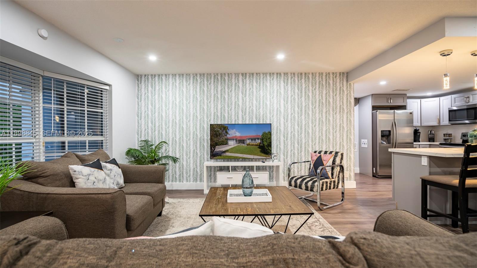 1305 Funston Street Hollywood, FL 33019 - Photo 12 of 93 a living room with furniture and a flat screen tv