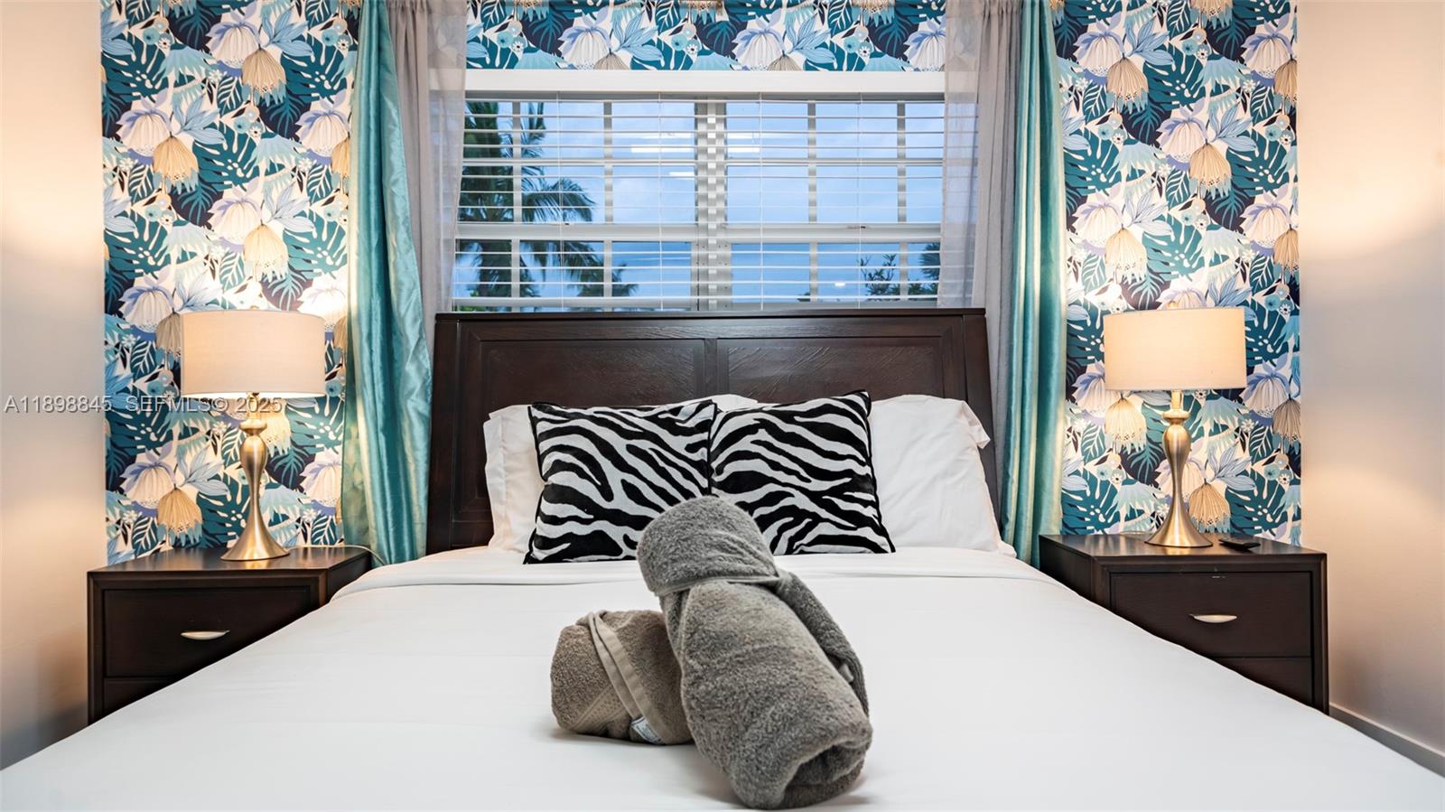 1305 Funston Street Hollywood, FL 33019 - Photo 14 of 93 a bedroom with a bed and a large window