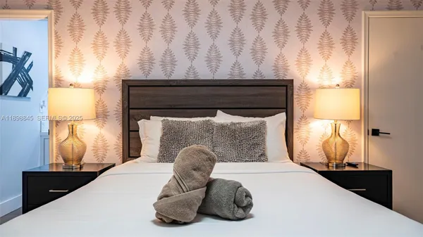 a front view of a house with a garden and yard