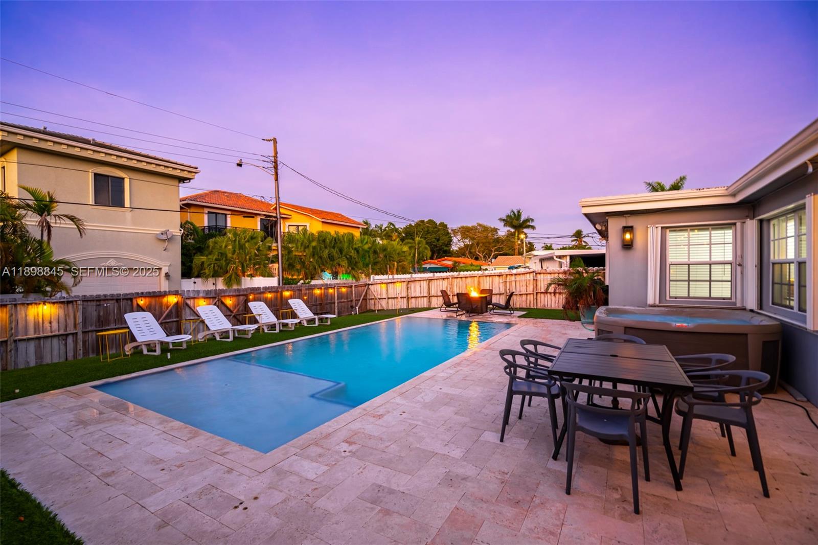 1305 Funston Street Hollywood, FL 33019 - Photo 23 of 93 a view of a patio with a table and chairs