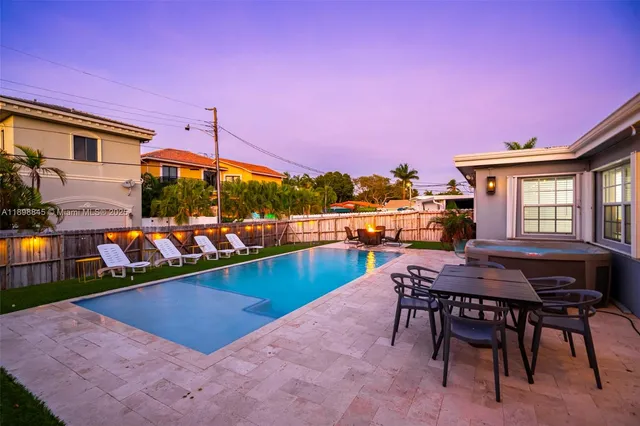 a bedroom with bed and a window