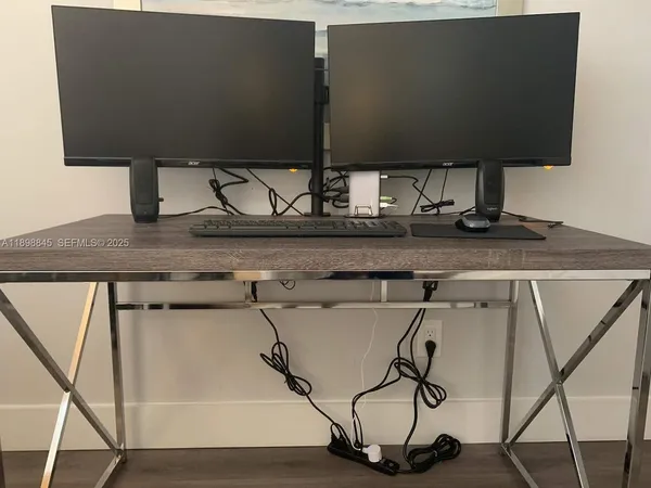 a bedroom with a bed and flat screen tv