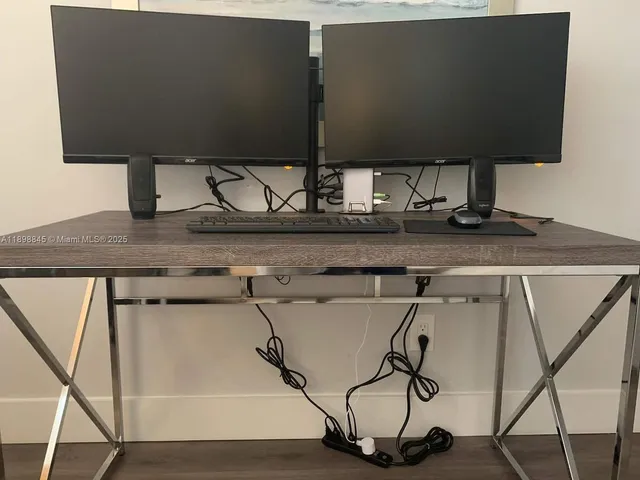 a bedroom with a bed and flat screen tv