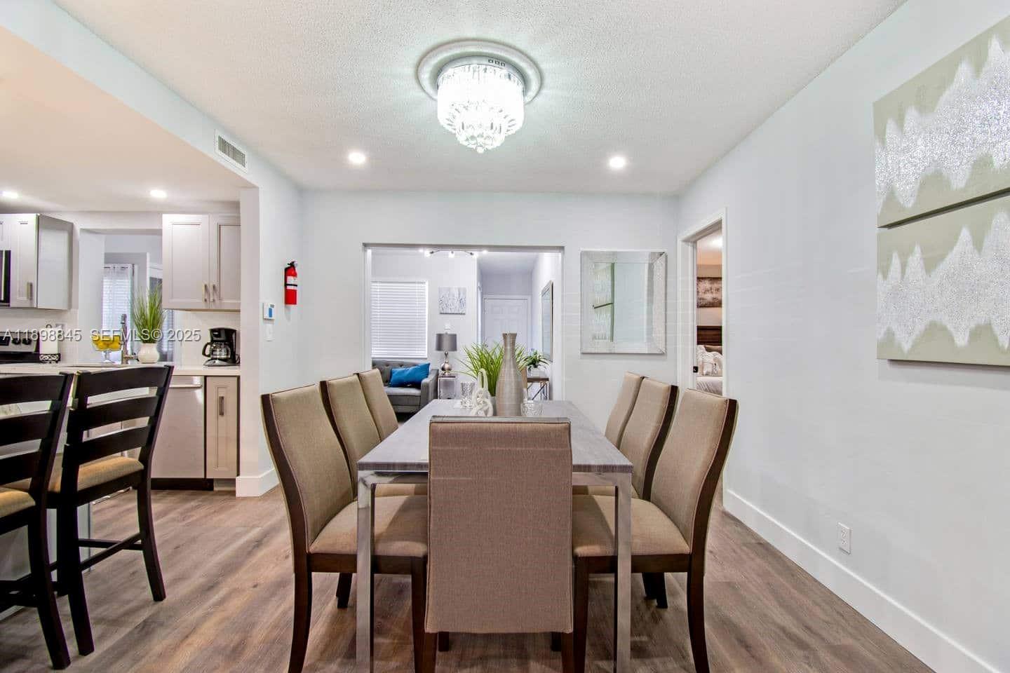 1305 Funston Street Hollywood, FL 33019 - Photo 29 of 93 a view of a dining room with furniture and wooden floor