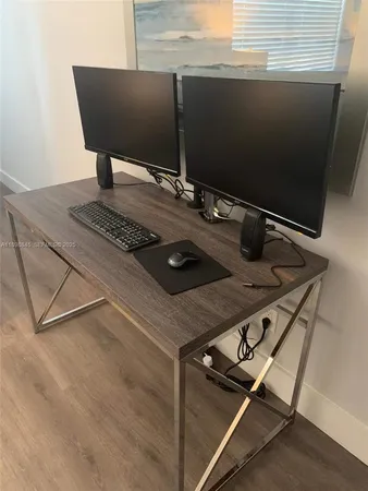 a view of a house with swimming pool and sitting area