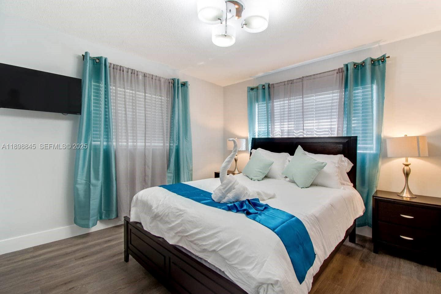 1305 Funston Street Hollywood, FL 33019 - Photo 41 of 93 a bedroom with bed and a window