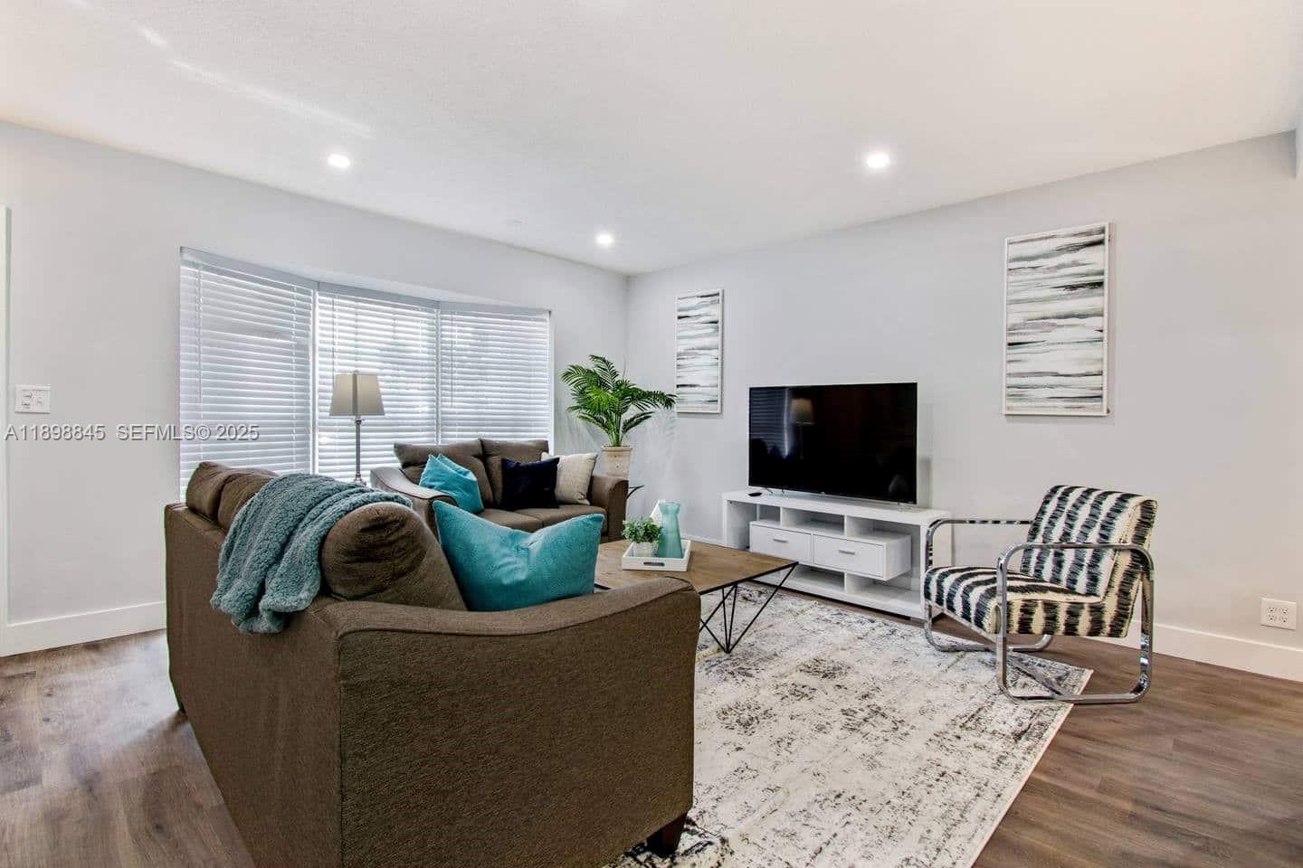 1305 Funston Street Hollywood, FL 33019 - Photo 43 of 93 a living room with furniture and a flat screen tv