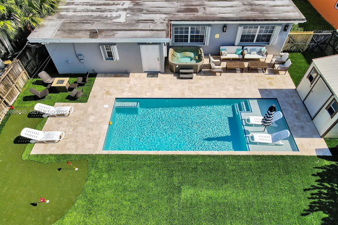 1305 Funston Street Hollywood, FL 33019 - Photo 49 of 93 an aerial view of a house with a yard