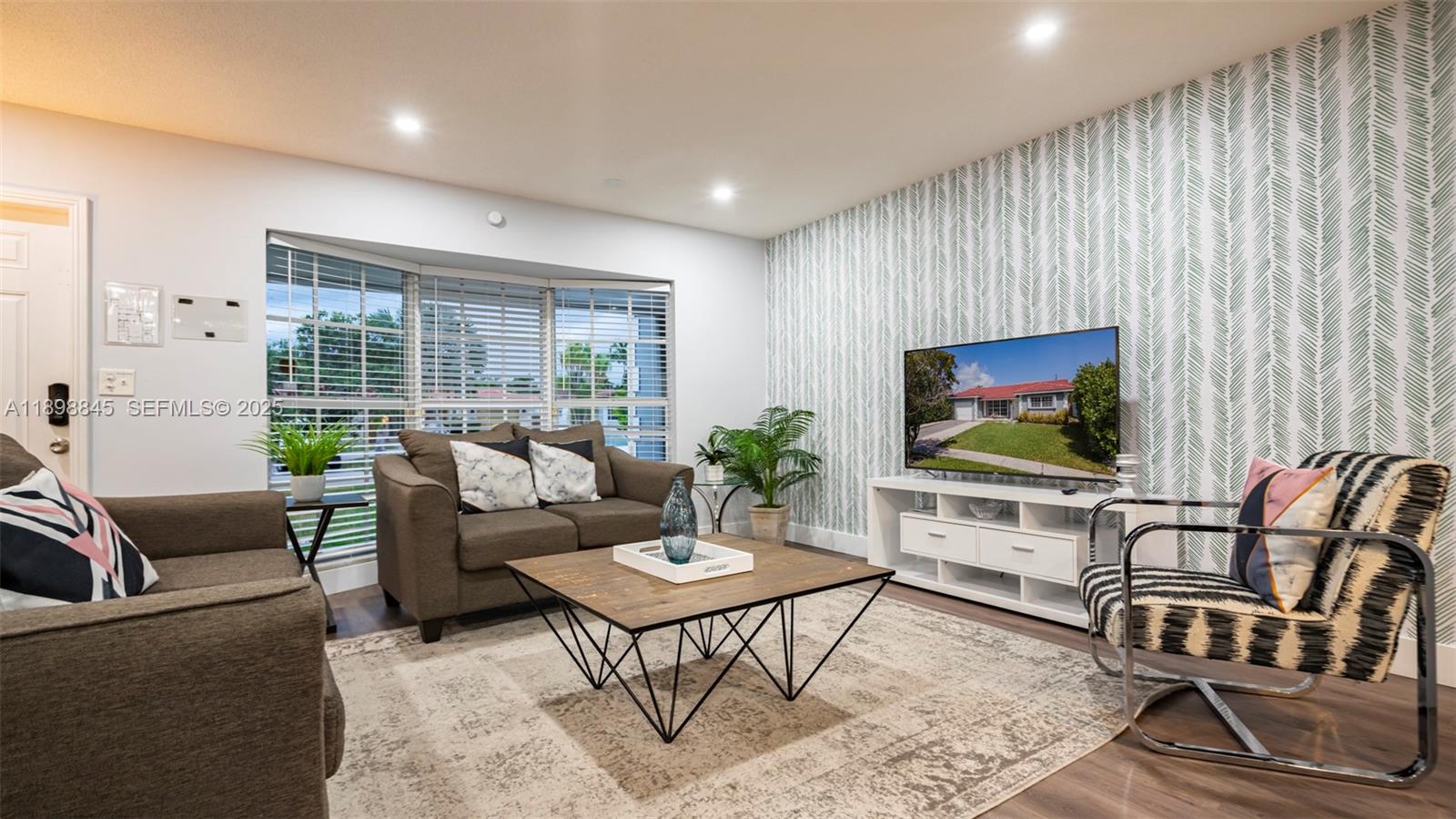 1305 Funston Street Hollywood, FL 33019 - Photo 5 of 93 a living room with furniture and a flat screen tv