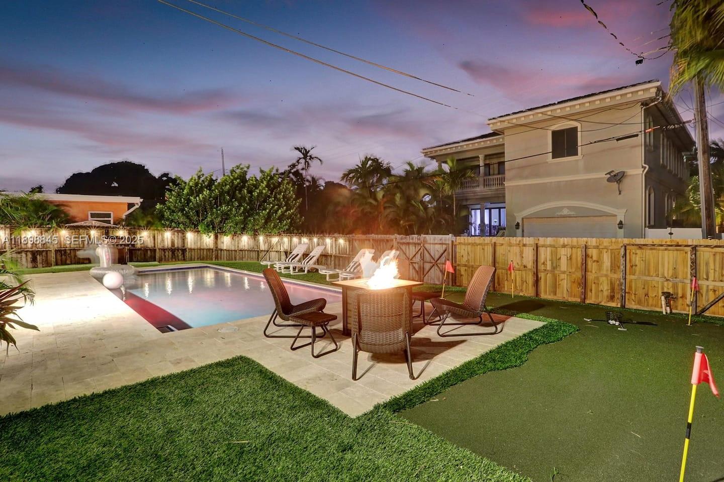 1305 Funston Street Hollywood, FL 33019 - Photo 53 of 93 a view of a swimming pool with a lounge chair