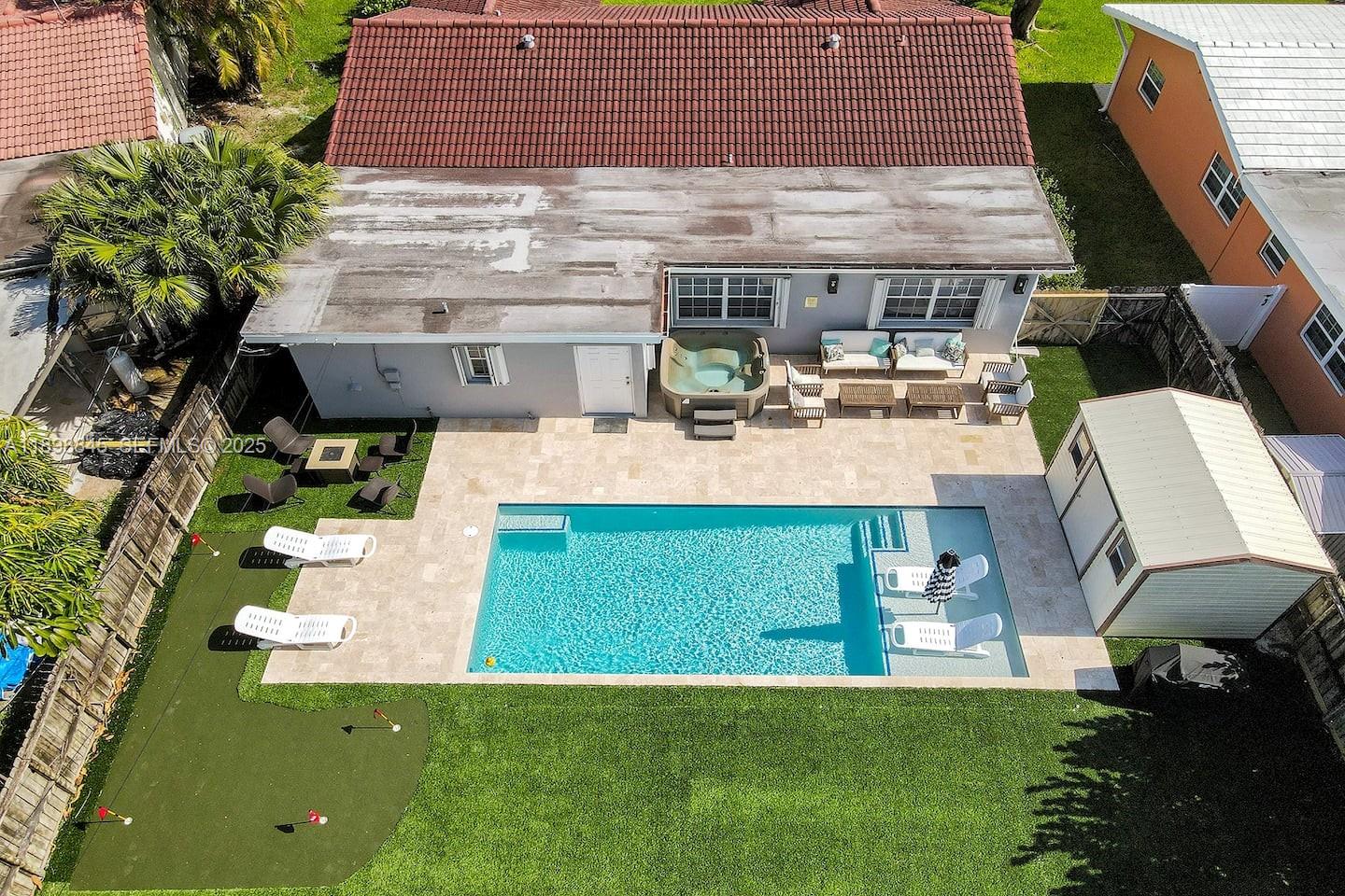 1305 Funston Street Hollywood, FL 33019 - Photo 69 of 93 a view of a house with backyard porch and sitting area