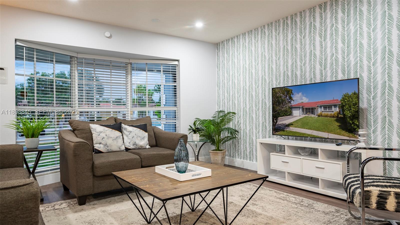 1305 Funston Street Hollywood, FL 33019 - Photo 7 of 93 a living room with furniture and a flat screen tv
