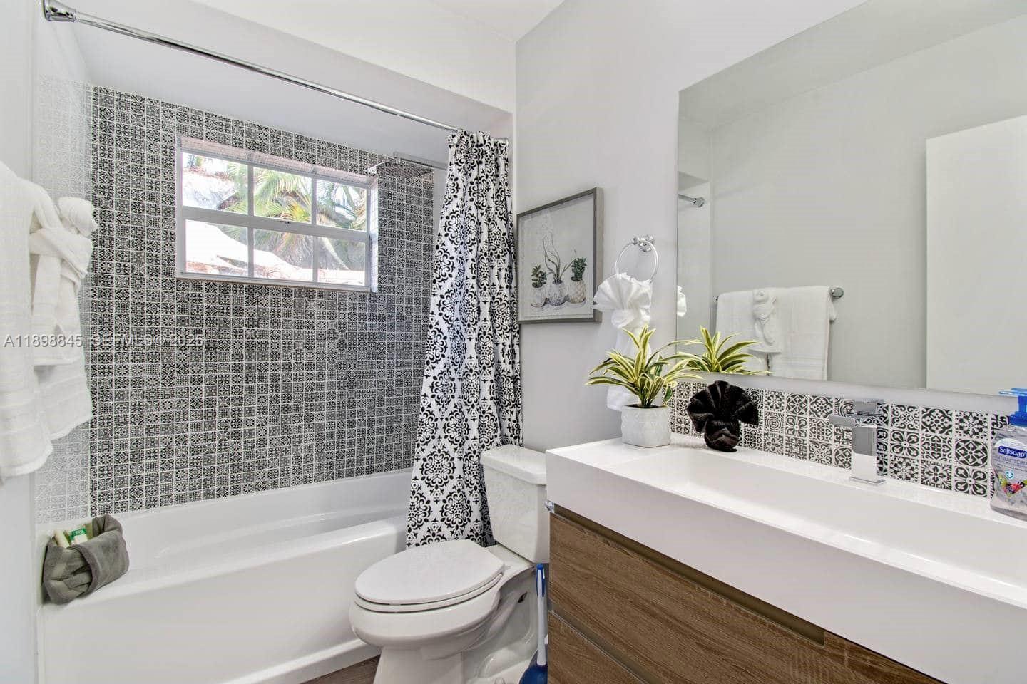 1305 Funston Street Hollywood, FL 33019 - Photo 73 of 93 a bathroom with a sink a toilet and shower