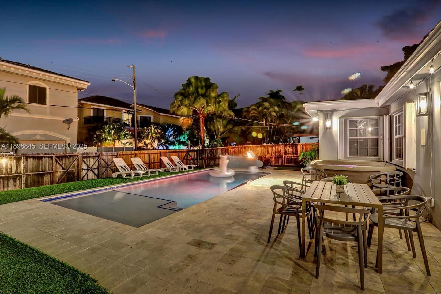 1305 Funston Street Hollywood, FL 33019 - Photo 75 of 93 a view of a patio with table and chairs with wooden floor