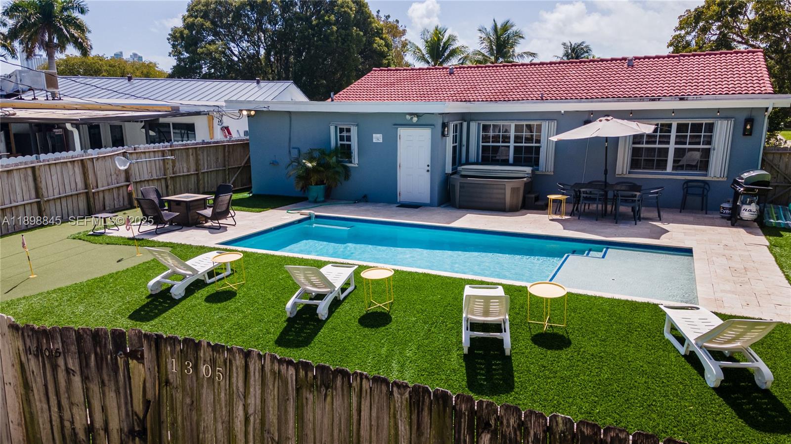 1305 Funston Street Hollywood, FL 33019 - Photo 84 of 93 a view of a house with backyard and sitting area